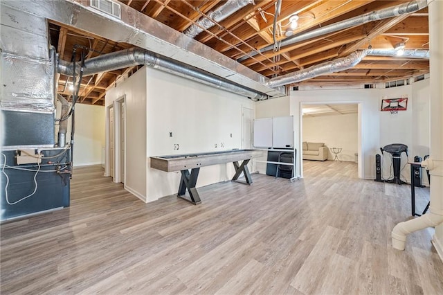 unfinished below grade area featuring light wood-style floors