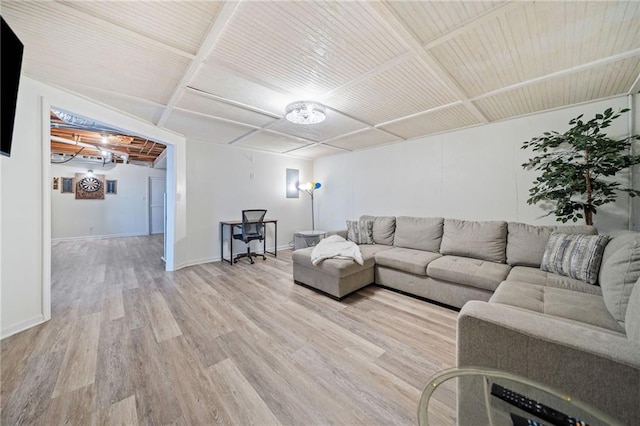 living area with baseboards and light wood finished floors