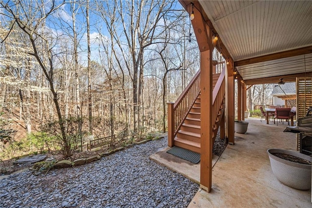 view of patio / terrace featuring stairs and outdoor dining space