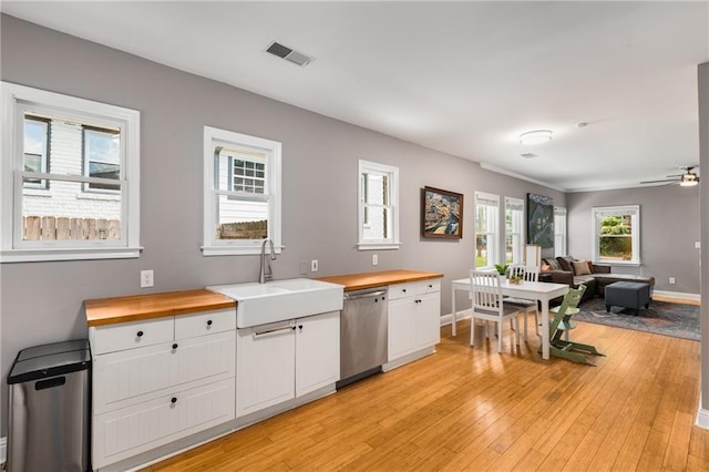 2486 Memorial Dr SE, Atlanta, GA 30317 - kitchen featuring wooden counters, dishwasher, a sink, and light wood-style flooring