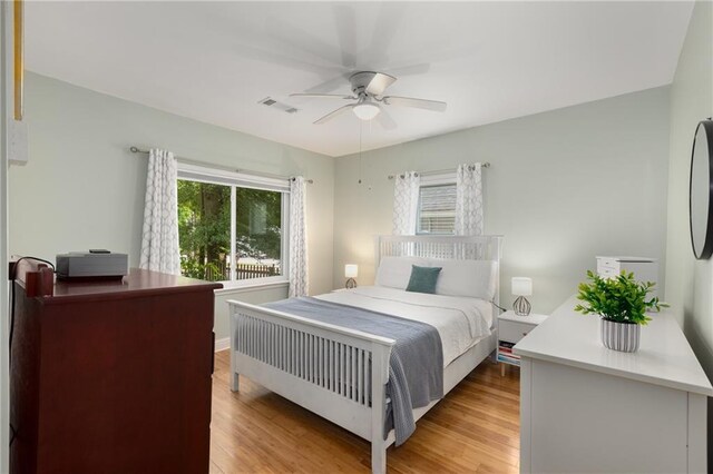 2486 Memorial Dr SE, Atlanta, GA 30317 - bedroom with light wood-type flooring and a ceiling fan