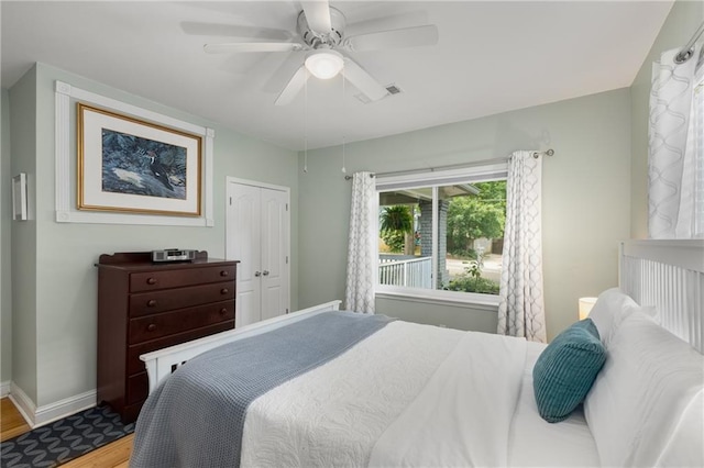 2486 Memorial Dr SE, Atlanta, GA 30317 - bedroom with baseboards, wood finished floors, ceiling fan, and a closet