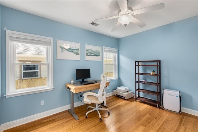 2486 Memorial Dr SE, Atlanta, GA 30317 - home office with light wood finished floors, a ceiling fan, and baseboards