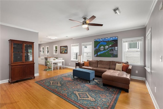 2486 Memorial Dr SE, Atlanta, GA 30317 - living area with ceiling fan, light wood-style flooring, crown molding, and baseboards