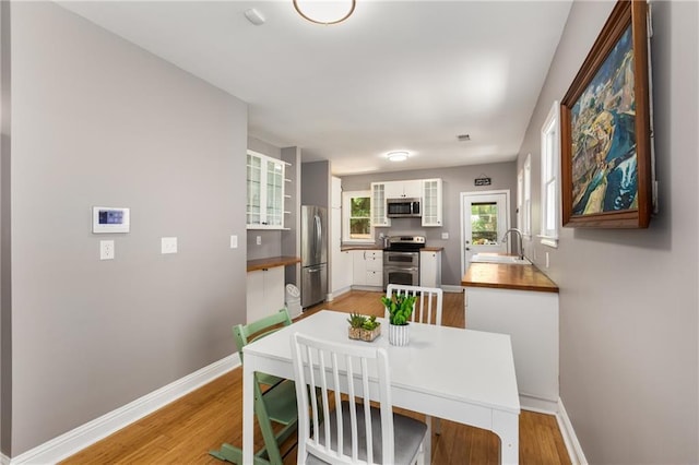 2486 Memorial Dr SE, Atlanta, GA 30317 - dining space with light wood-style floors and baseboards