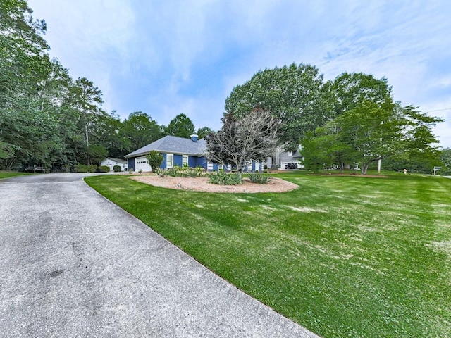 106 Warwick Way SE, Rome, GA 30161 - view of front of house with an attached garage, a front lawn, and driveway