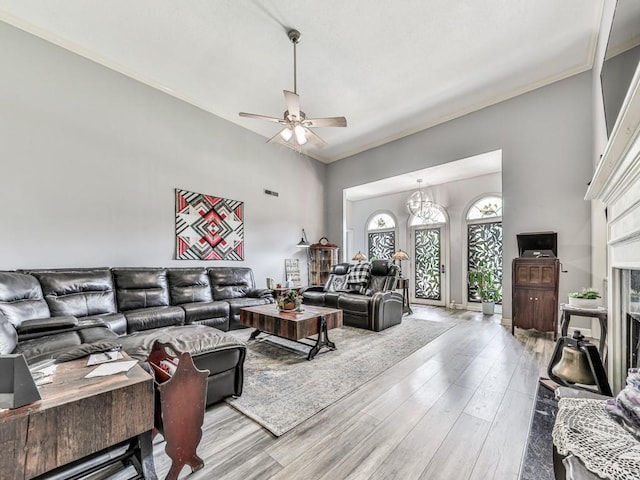 106 Warwick Way SE, Rome, GA 30161 - living room featuring crown molding, wood finished floors, a ceiling fan, and a fireplace