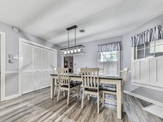 106 Warwick Way SE, Rome, GA 30161 - dining area with wood finished floors and baseboards