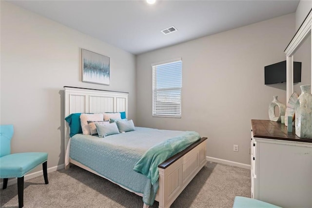 bedroom featuring light colored carpet