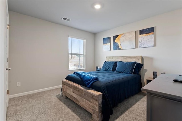 bedroom with light carpet