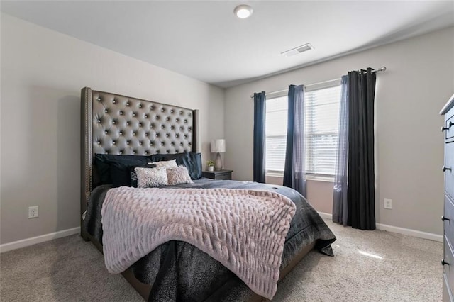 bedroom with light colored carpet