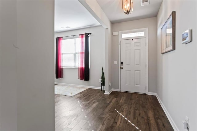 foyer with dark wood-type flooring