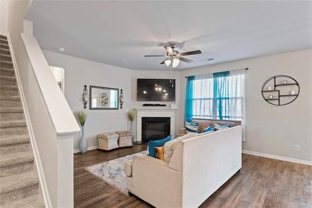 living room with ceiling fan and wood-type flooring