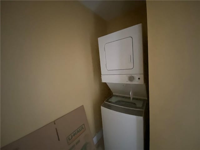 washroom with stacked washer / drying machine