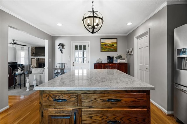 4286 Pool Rd, Winston, GA 30187 - kitchen with stainless steel fridge with ice dispenser, light wood finished floors, recessed lighting, ornamental molding, and a chandelier
