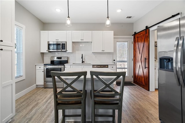 4286 Pool Rd, Winston, GA 30187 - kitchen with stainless steel appliances, a sink, healthy amount of natural light, white cabinets, and recessed lighting