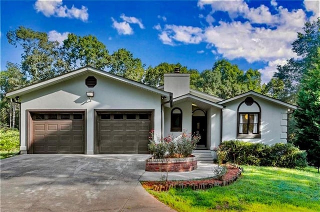 ranch-style home featuring a garage, driveway, a chimney, and stucco siding