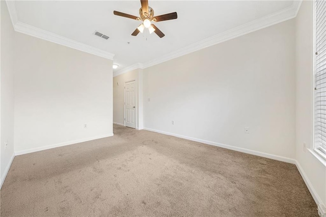 unfurnished room featuring crown molding, carpet floors, and ceiling fan