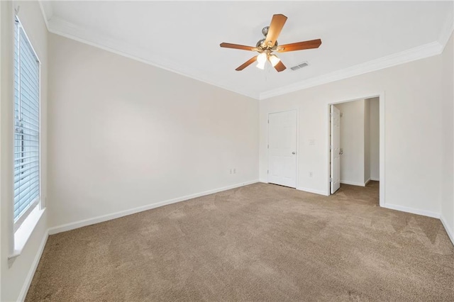 unfurnished bedroom with light carpet, ornamental molding, and ceiling fan