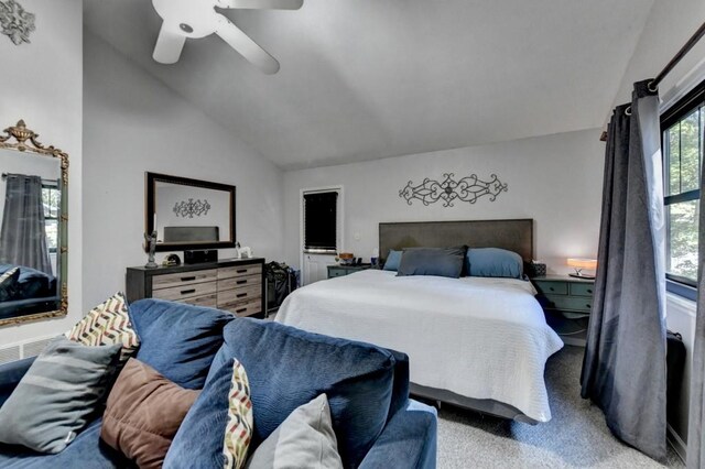 carpeted bedroom featuring ceiling fan and high vaulted ceiling