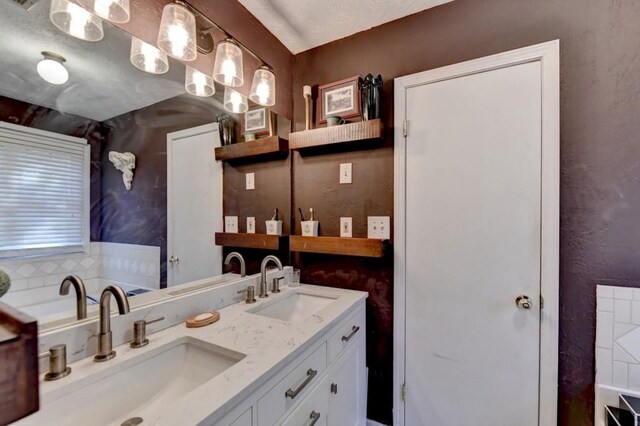 bathroom featuring vanity and tasteful backsplash