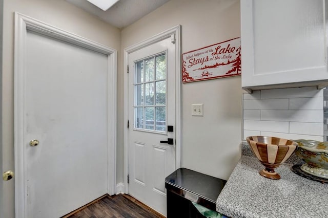 entryway with dark hardwood / wood-style floors