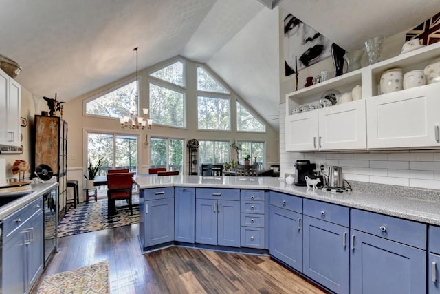 kitchen featuring a chandelier, plenty of natural light, decorative light fixtures, and dark hardwood / wood-style floors