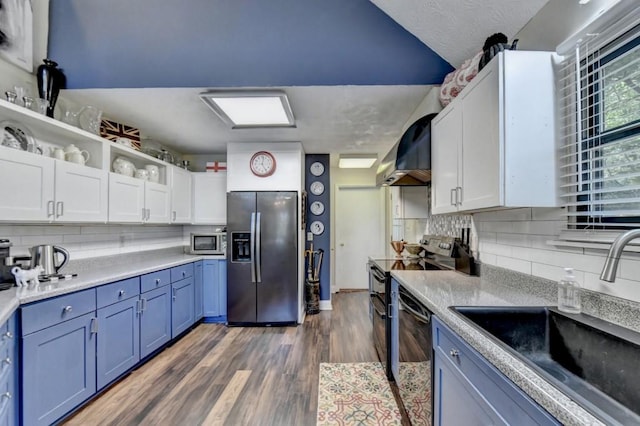 kitchen featuring dark hardwood / wood-style flooring, sink, white cabinets, and appliances with stainless steel finishes