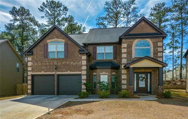view of front of house with brick siding, a garage, and concrete driveway