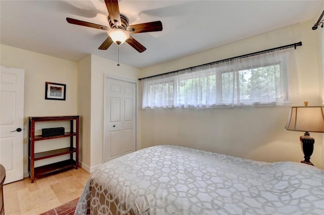 bedroom with a ceiling fan and wood finished floors