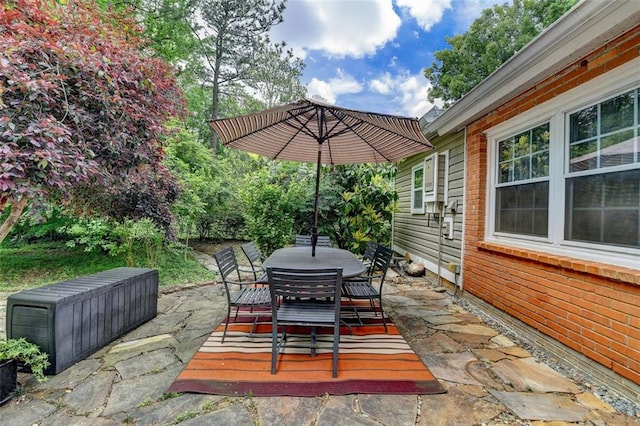 view of patio featuring outdoor dining area