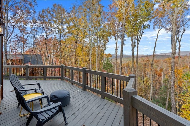 wooden deck featuring a wooded view