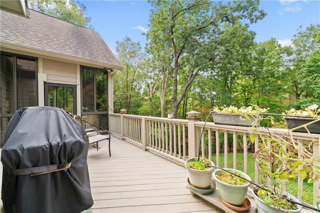 wooden terrace with area for grilling