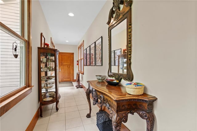 hallway with light tile patterned floors