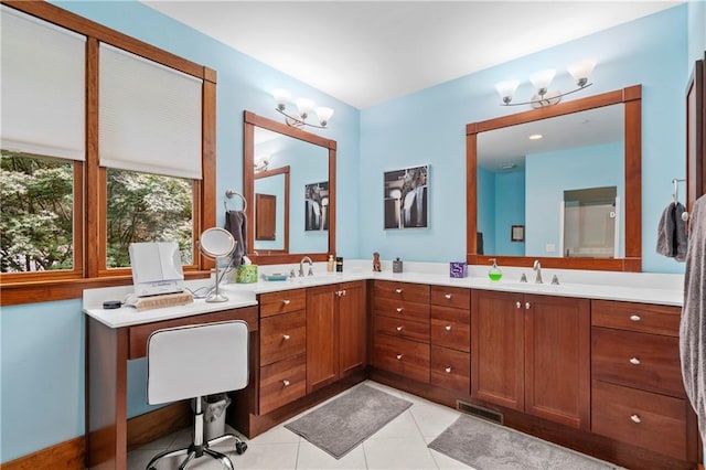 bathroom featuring tile patterned flooring and vanity