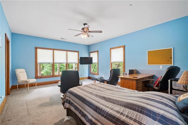 carpeted bedroom featuring ceiling fan