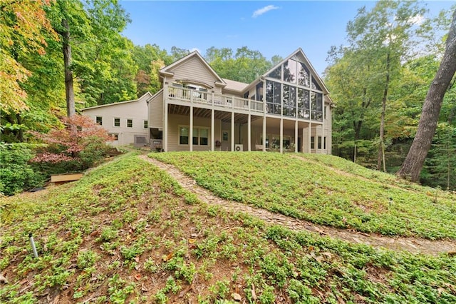 back of house featuring a deck