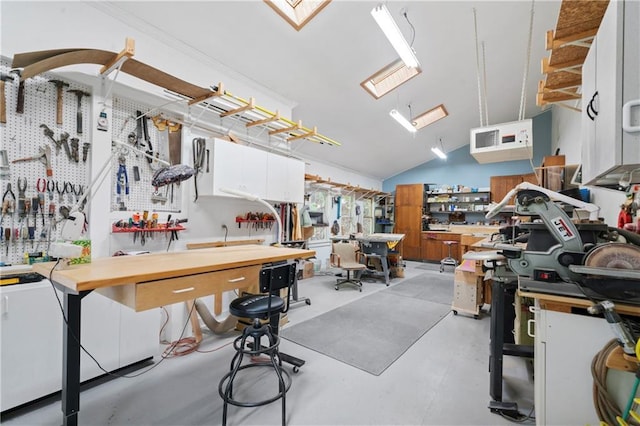 interior space featuring lofted ceiling and white cabinets