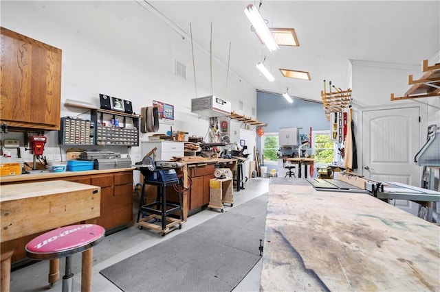 kitchen with high vaulted ceiling