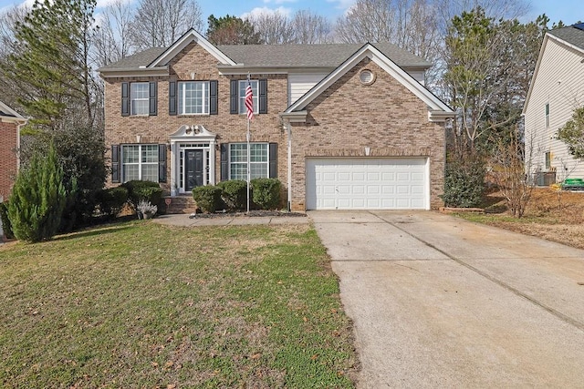 view of front of home featuring central AC unit, a garage, and a front yard