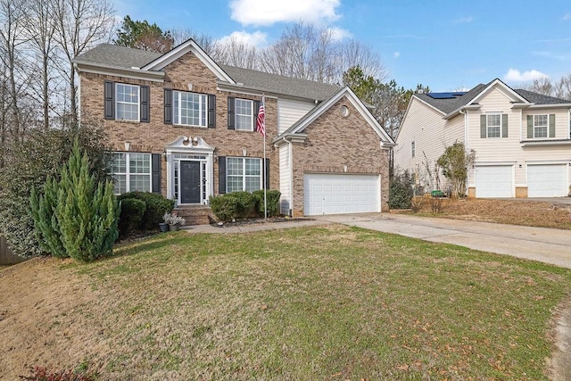 view of front of home featuring a garage and a front lawn