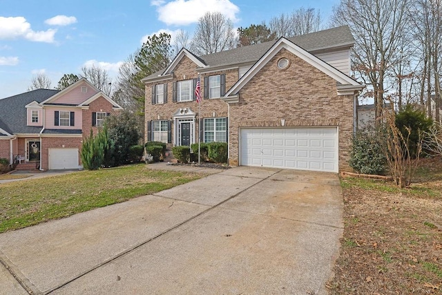 view of front of house with a garage and a front lawn