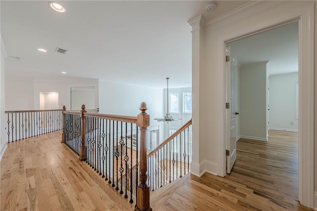 hall featuring crown molding and wood-type flooring