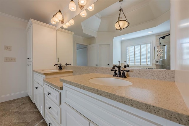 bathroom with crown molding, vanity, and tile patterned floors