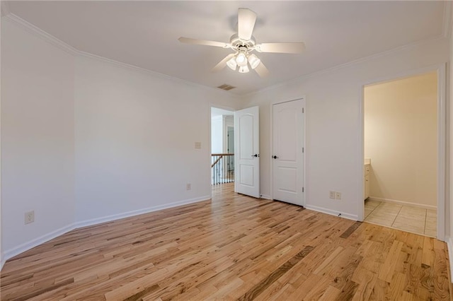 unfurnished bedroom with crown molding, ceiling fan, light hardwood / wood-style floors, and ensuite bath