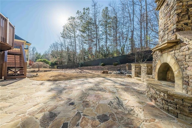 view of patio / terrace with an outdoor stone fireplace