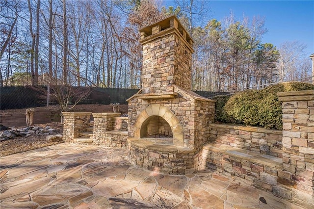 view of patio / terrace with an outdoor stone fireplace