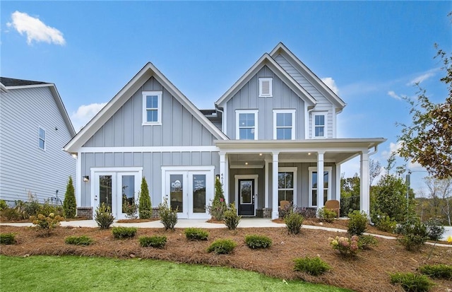 5230 Hyde Rd, Cumming, GA 30040 - view of front of house with board and batten siding, french doors, and covered porch