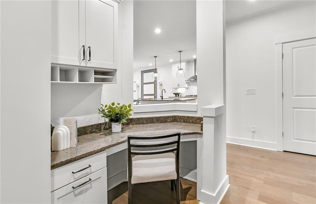 5230 Hyde Rd, Cumming, GA 30040 - kitchen featuring light wood-style floors, white cabinets, ornamental molding, and recessed lighting