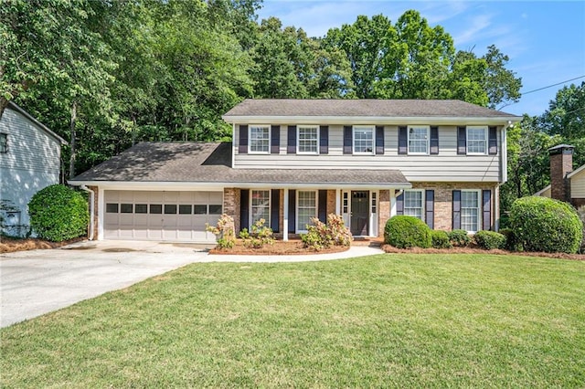 1703 W Nancy Creek Dr NE, Brookhaven, GA 30319 - view of front of property featuring driveway, a garage, covered porch, a front yard, and brick siding